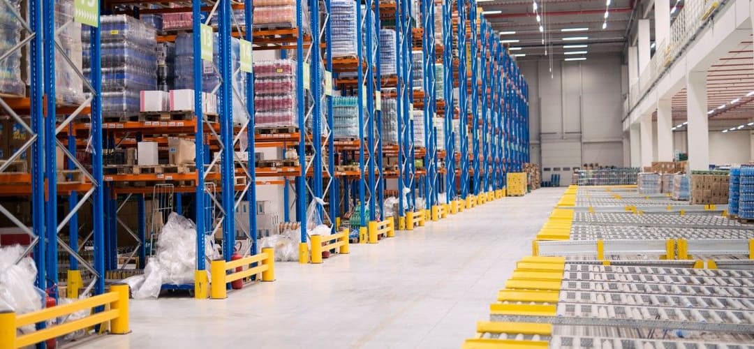 Warehouse storage interior with shelves loaded with goods
